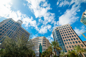 A view from the ground of three luxury high-rise buildings in Florida.