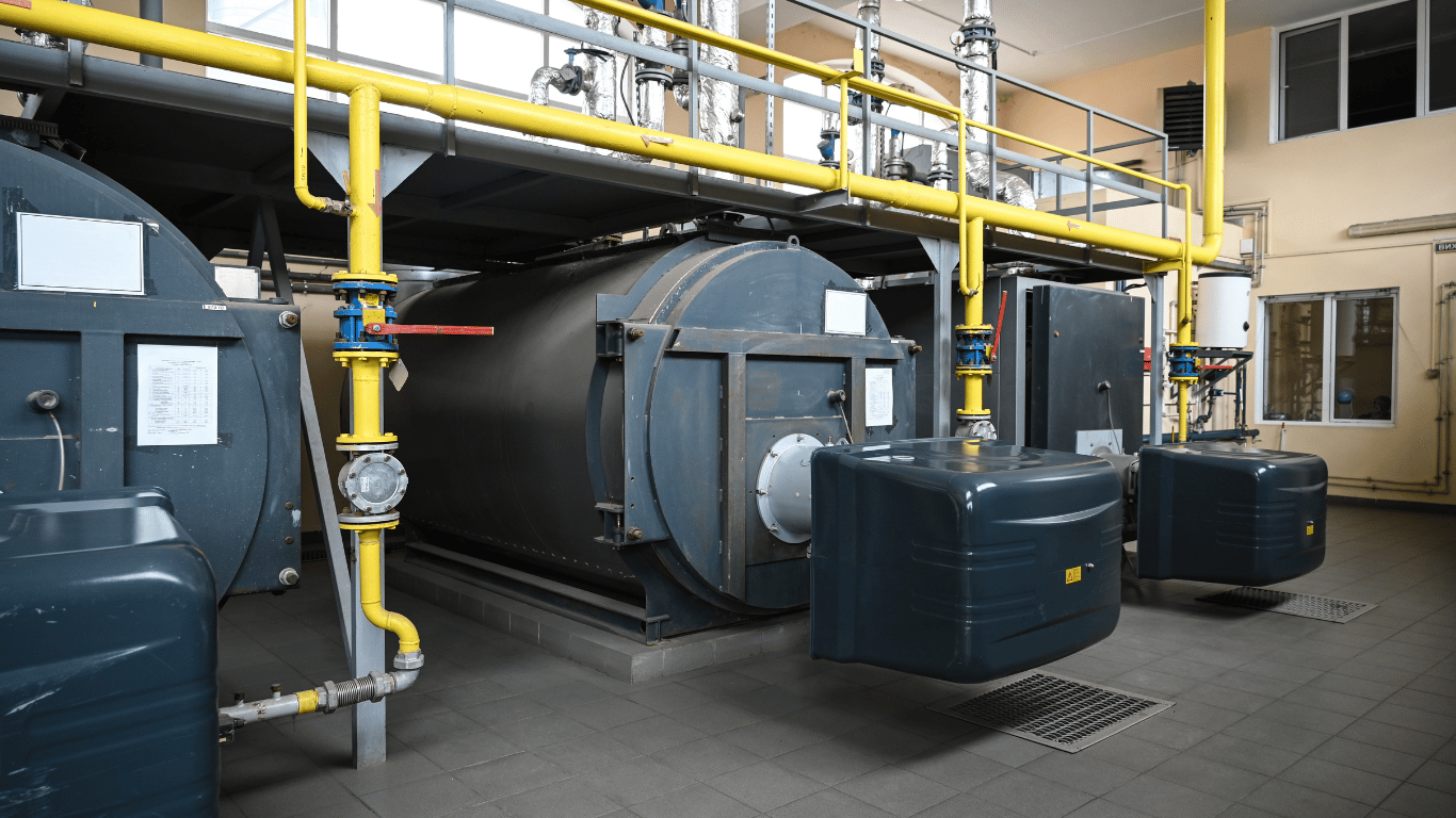 Industrial boiler blowdown system with boilers, piping, valves, and equipment for boiler water and steam management.