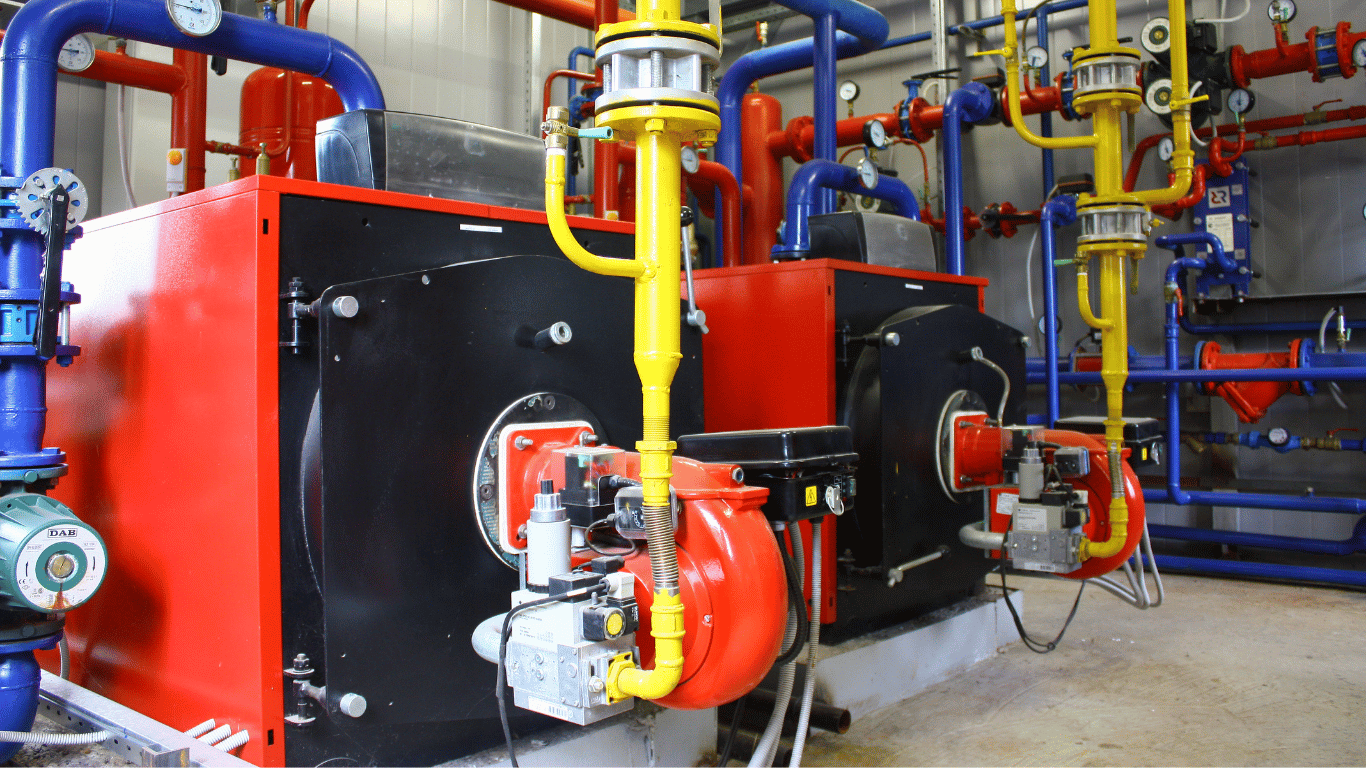 Industrial steam boilers in a boiler systems room illustrate boiler corrosion prevention through controlled boiler water ph, dissolved oxygen, corrosion inhibitors, oxygen scavengers, chemical treatment, water chemistry, and corrosion protection, with boiler tubes, boiler components, heat exchangers, steel surface protection, and oxygen control supporting boiler reliability, boiler efficiency, heat transfer efficiency, thermal efficiency, and proper operation.