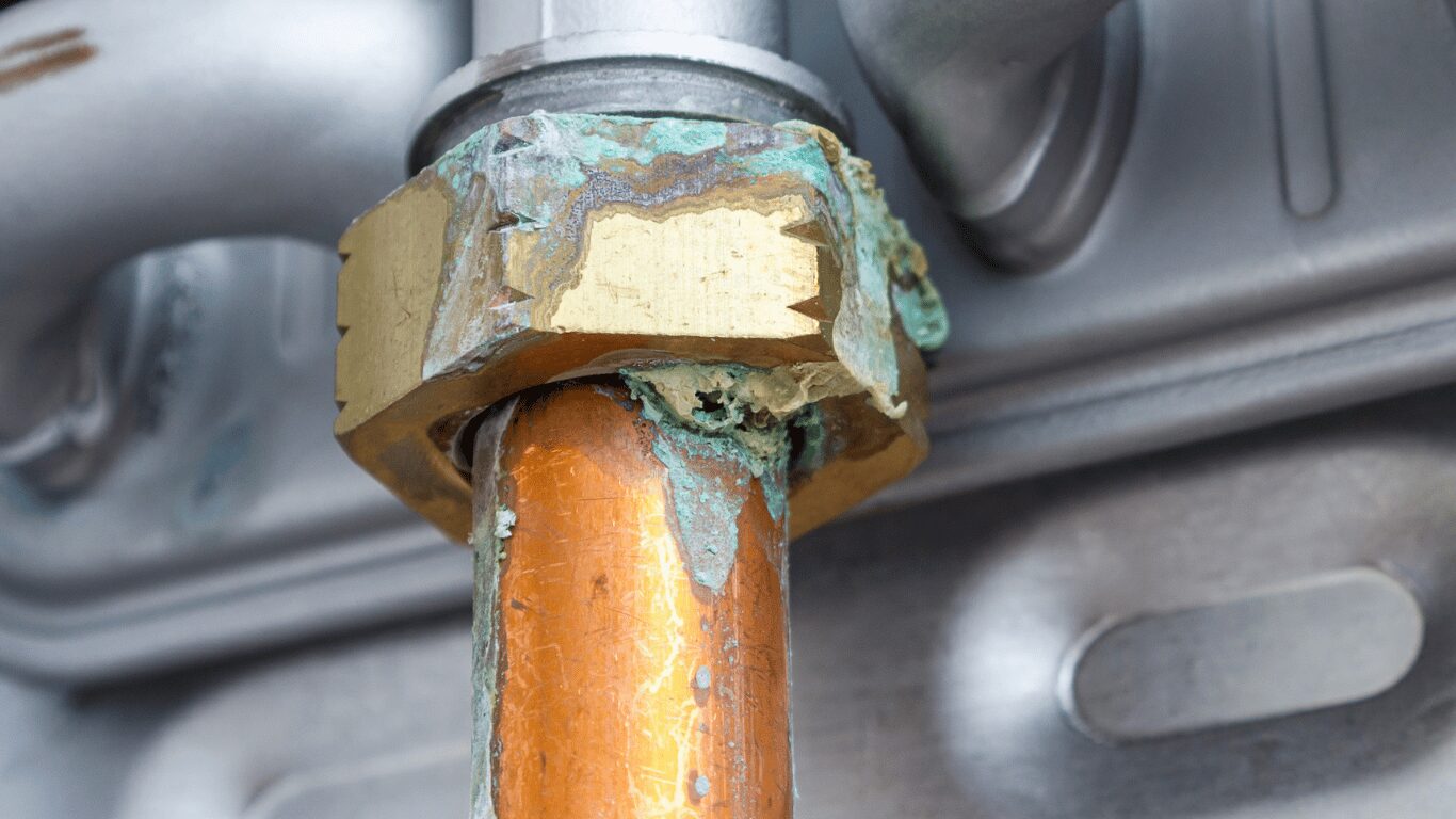 Corroded copper connection on a steam boiler in a closed loop boiler water system showing rust, scale, dissolved oxygen damage, oxygen pitting, and failing metal surfaces that a corrosion inhibitor program and effective boiler treatment help prevent while protecting system components and extending boiler life.
