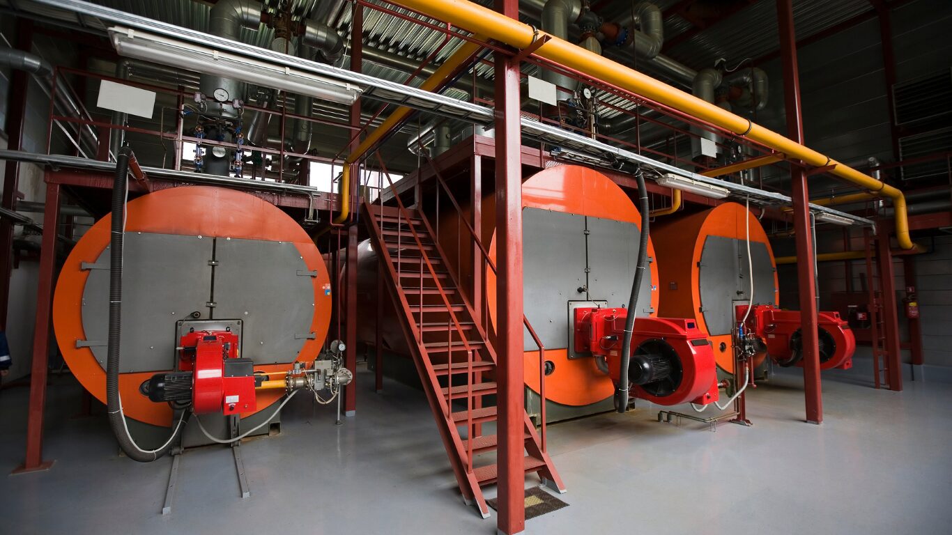 Industrial boiler system with multiple pressure boilers, steam lines, control valves, and water tube boilers designed to improve steam quality, maintain steam pressure, support high purity steam production, and reduce chemical carryover and steam contamination through proper boiler water treatment and boiler water chemistry control.