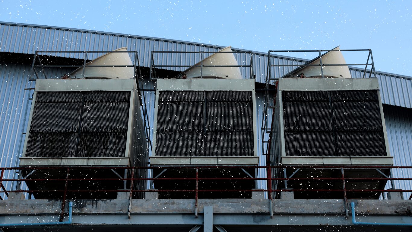 Cooling tower system during winter weather as temperatures drop, highlighting winterizing your cooling tower, cooling systems maintenance, tower fill, cold water basin, water flow, prevent freezing, heat transfer, and tower winterization to maintain efficient performance and avoid costly repairs.