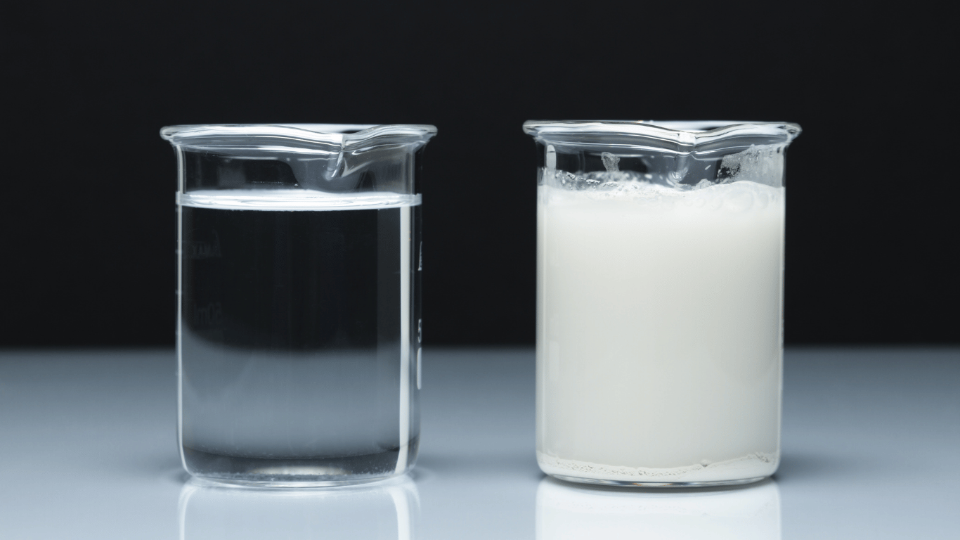 Two beakers illustrating a glycol water mixture, comparing a clear fluid and a concentrated solution used in heat transfer and cooling systems.