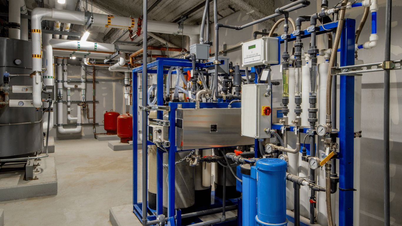 Commercial water filtration and reverse osmosis systems installed at a Bradenton, FL facility, featuring industrial plumbing, filtration equipment, pressure gauges, and water treatment components for commercial water quality management.